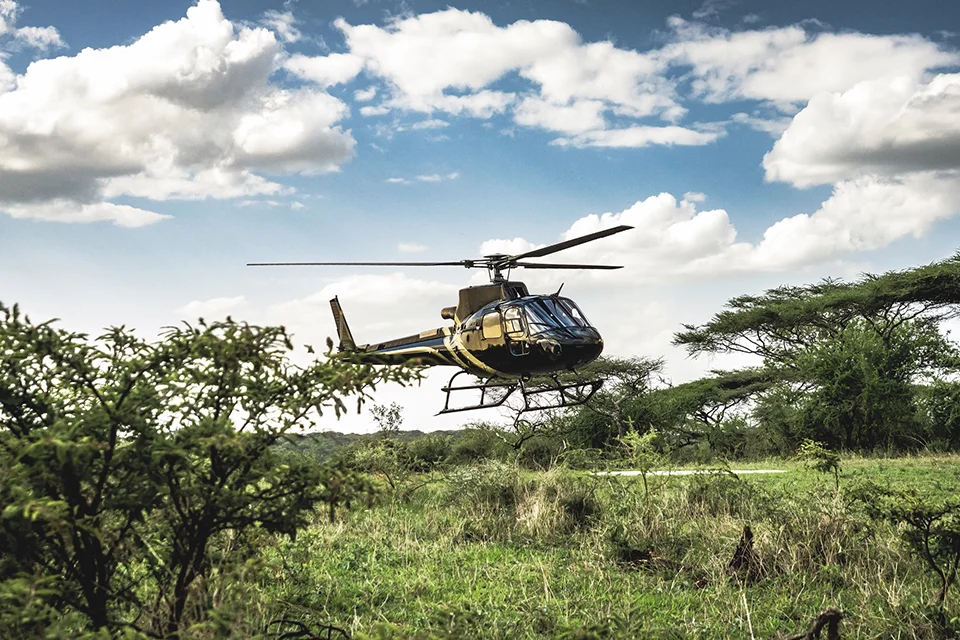 Helicopter landing in the Serengeti for a luxury fly-in safari experience