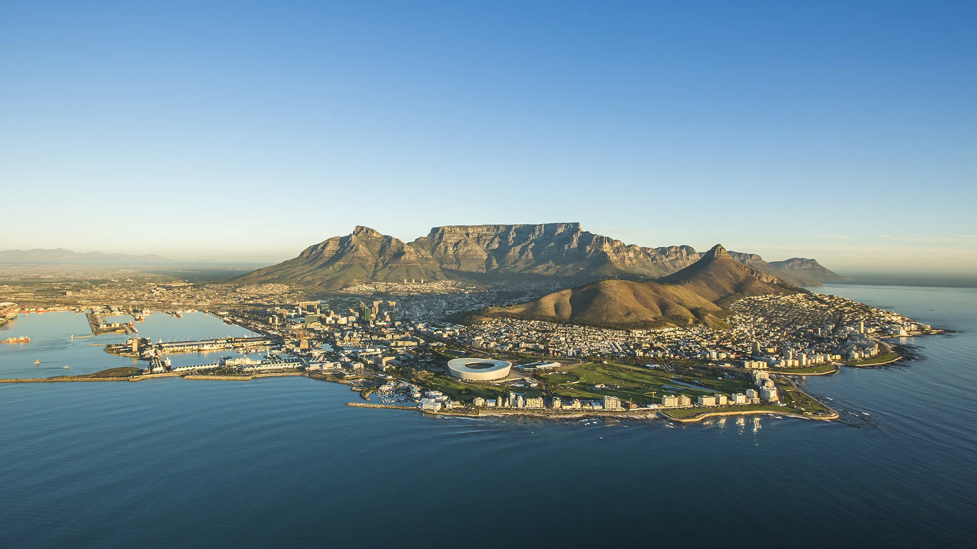 Aerial view of Cape Town with Table Mountain, Lion’s Head, Cape Town Stadium and the Atlantic Ocean