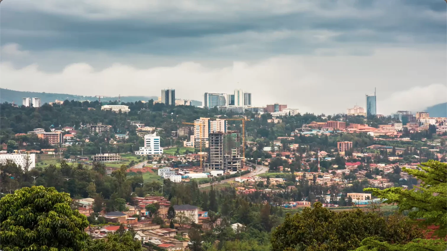 Kigali city skyline with storm clouds